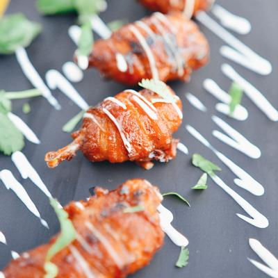 Juicy, seasoned chicken legs grilled to perfection at Uno Mas - Tex-Mex Cantina in Dallas, TX.