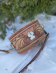 Top view of custom hand tooled leather bag with fig branch details.