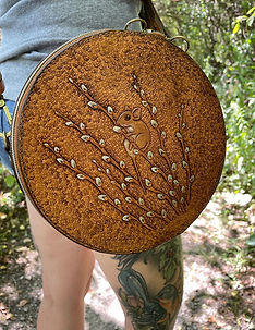 Handcrafted leather bag featuring a deer mouse and pussy willow branches.