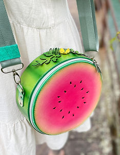 Handcrafted leather watermelon slice with hand painted details.