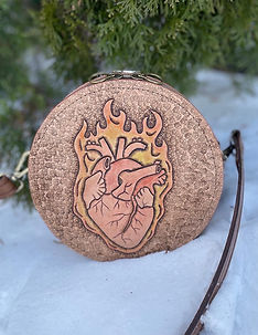 Custom ordered, hand tooled leather bag with burning heart design.