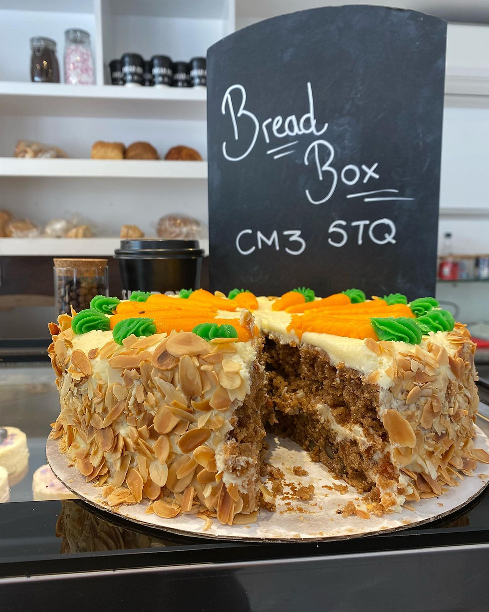 Display case of cakes and sweet treats at Bread Box Bakery