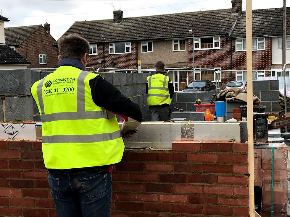 Bricklayers in Maldon collaborating on a large construction project