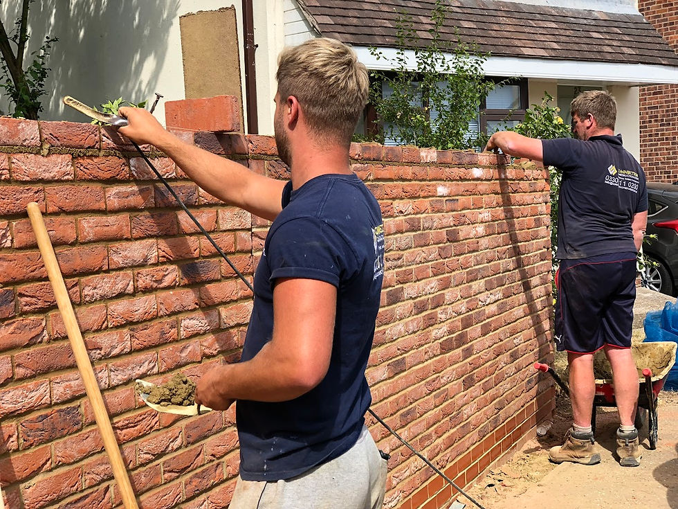 Professional bricklayer demonstrating expert brick wall building techniques in Essex