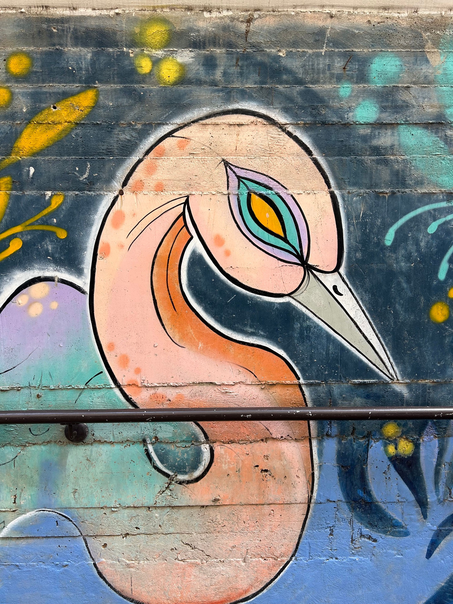 students listening to their teacher who is standing in front of the class