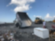 Action Junk Removal Truck full of Junk dumping at a Largo Florida Dump Landfill