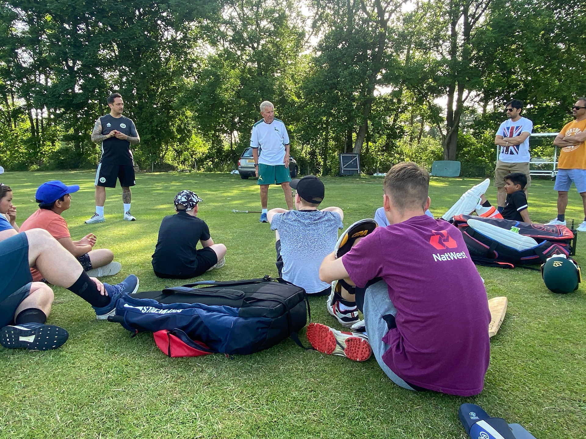 Coach Talking as part of cricket coaching croup session