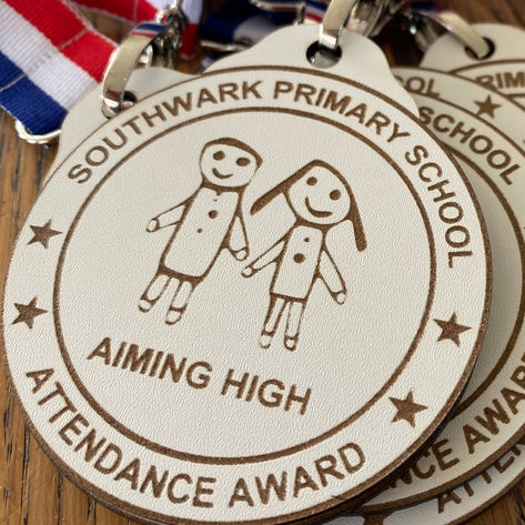 Medal To Reward Good Attendance In School with bold and colourful red, white and blue medal ribbon