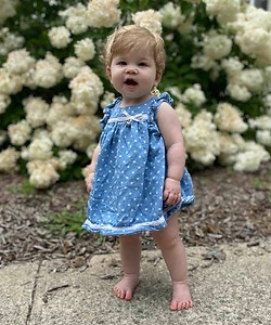 baby girl in a blue jean dress