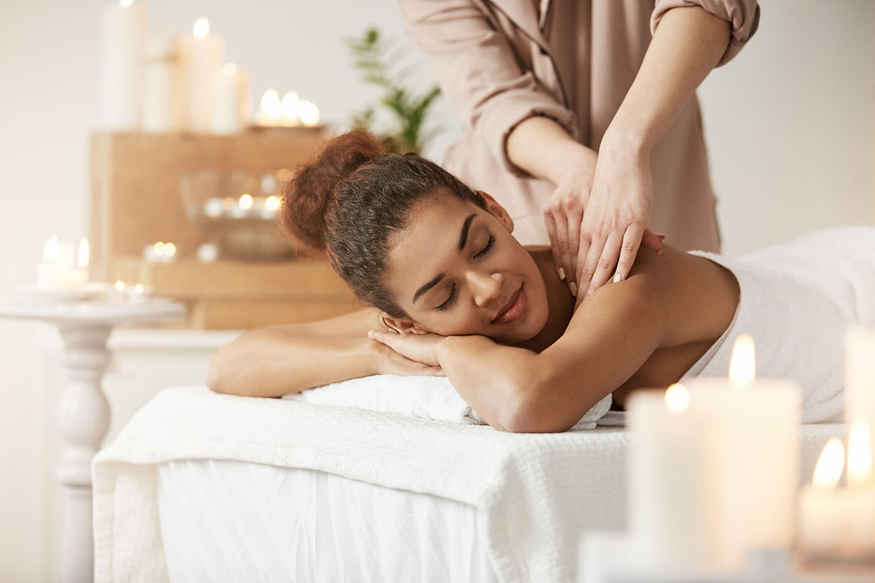 tender-african-woman-smiling-enjoying-massage-with-closed-eyes-in-spa-resort_edited.jpg