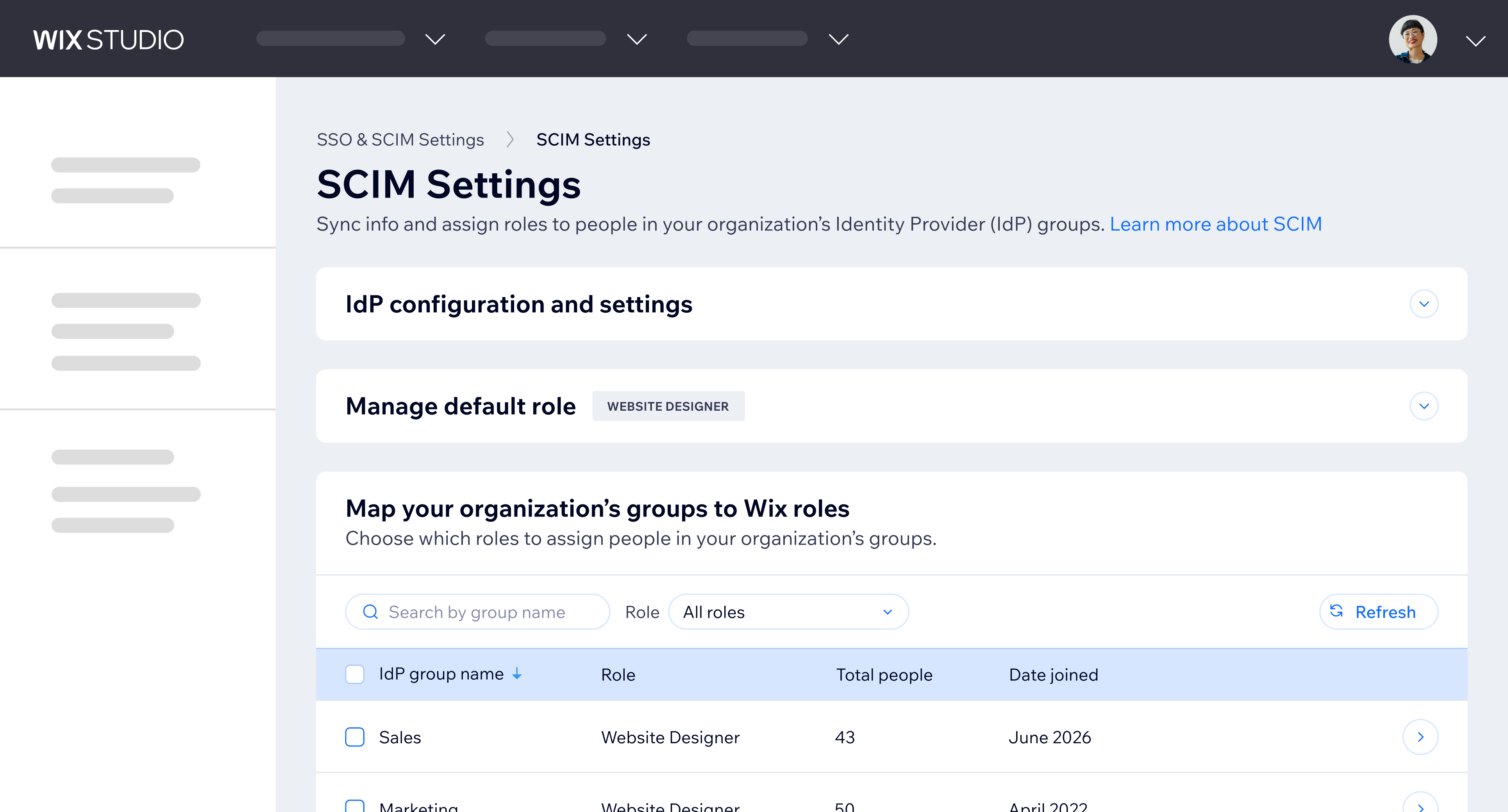 SCIM settings page mapping organization groups like Sales and Marketing to Wix roles such as Website Designer