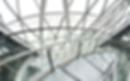 Glass atrium roof and curved staircase