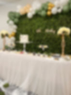 Safari theme dessert table with cake, cookies, and macaroons.