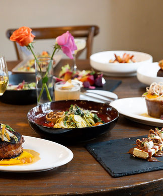 La Colline Restaurant Castroville Texas table full of dinner entrees.jpg