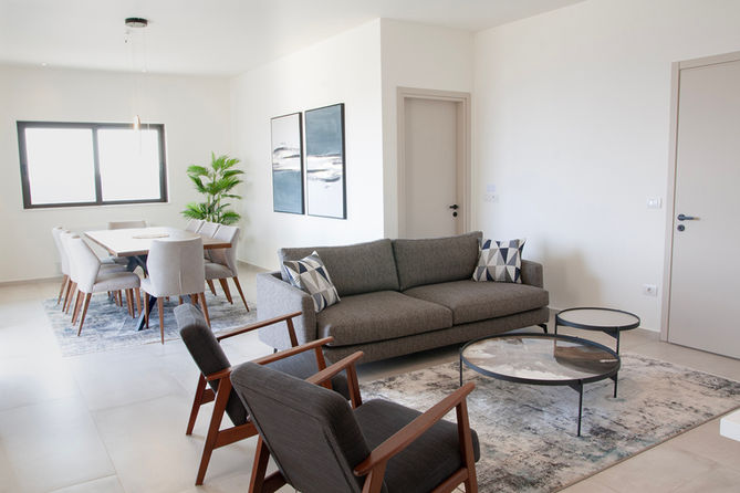 apartment-livingroom-dining-modern-grey-blue-sofa-clubseat-villa-anvers-holiday-resort-cha