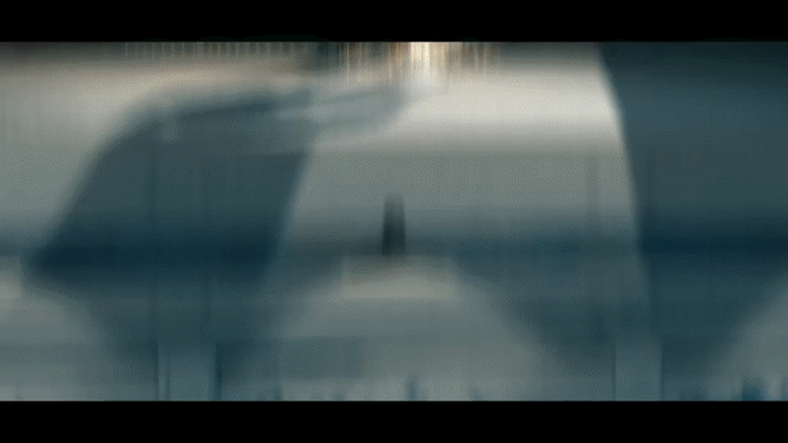 A gif shot of Ciara with a time-lapse day to night transition in the background.