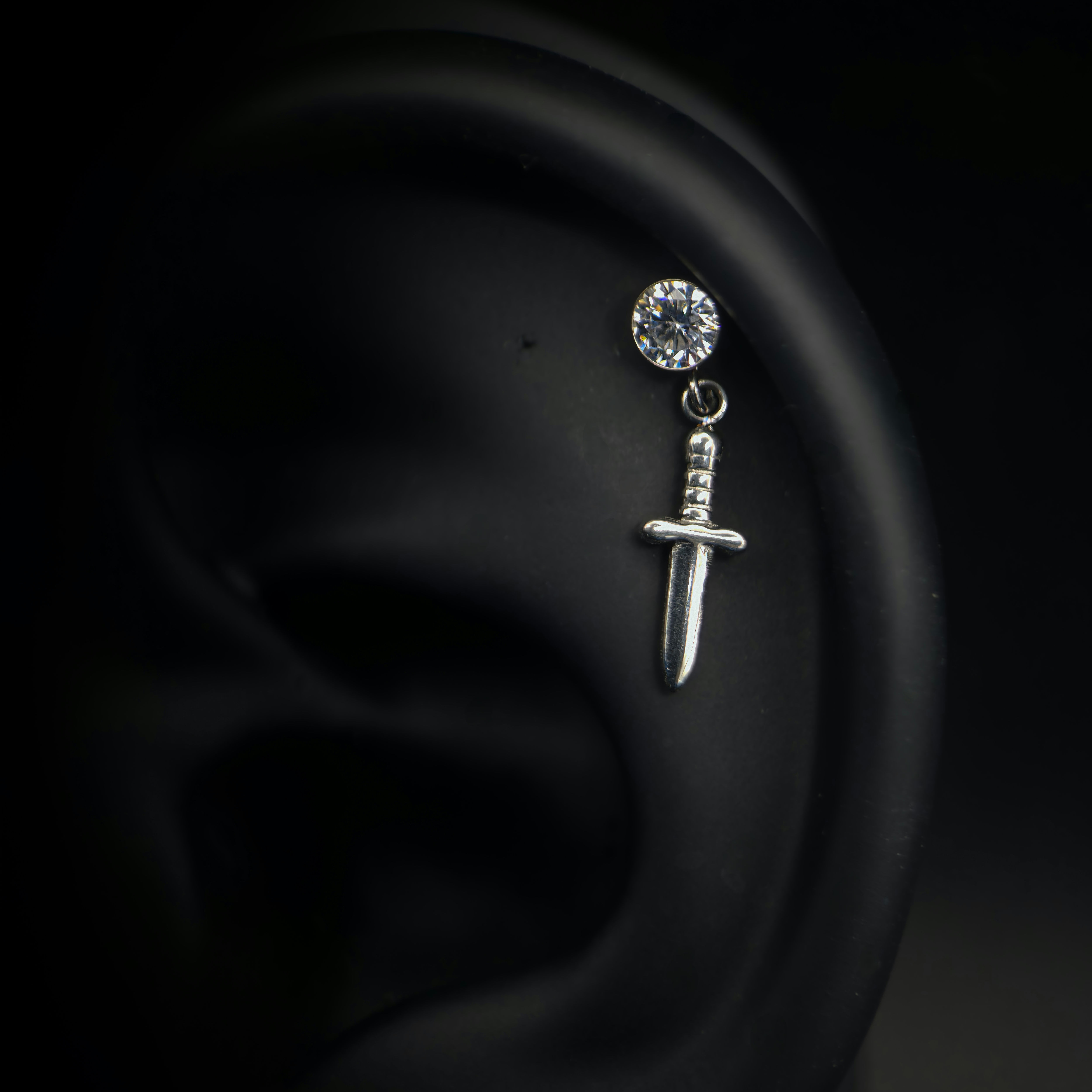 Threadless sword with dangling gem attachment