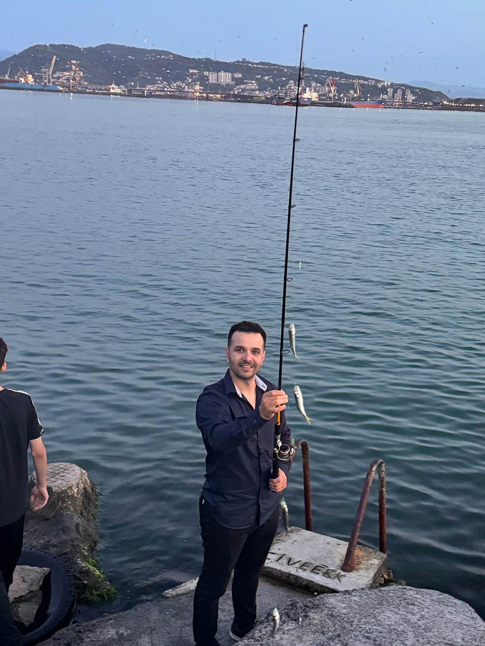 Catching fresh Black Sea horse mackerel with fishing rod at the port