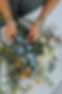 Franie's Flowers inspecting the fresh flowers for an order.  