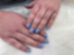 Hands with light blue manicured nails