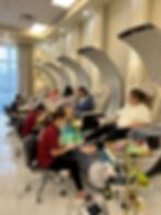 Customers receiving pedicures at modern Nail Salon Baton Rouge