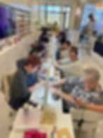 Busy Nail Salon Baton Rouge with clients getting manicures.