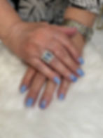 Manicured hands with periwinkle nails