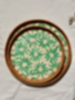 Overhead view of green floral mother of pearl round rattan tray set of 2 — home decor UAE