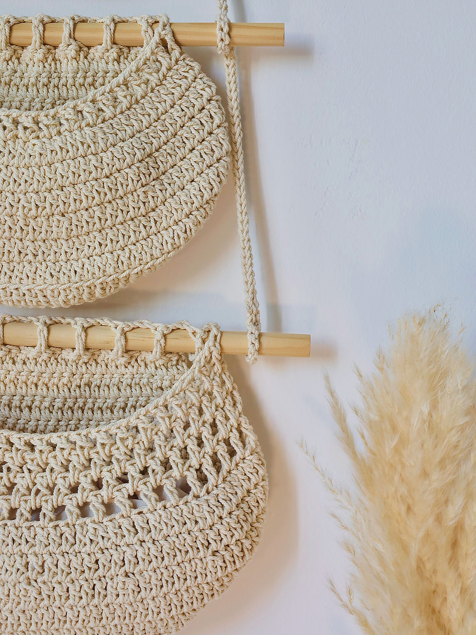 Thumbnail: Close up of natural beige macramé wall hanging compartments on wooden dowels - ELA The Eco Store UAE