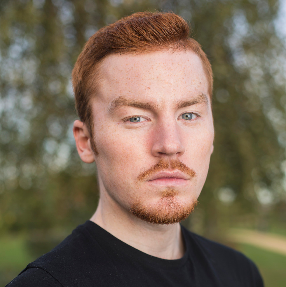A headshot of a serious-looking man