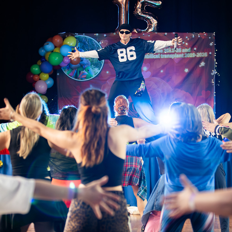 An energetic moment at a large dance event.