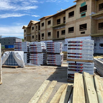 Construction materials on site at The Crossing on Boyson roofing project