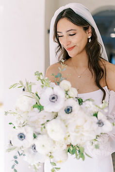 bride with white flower bouquet