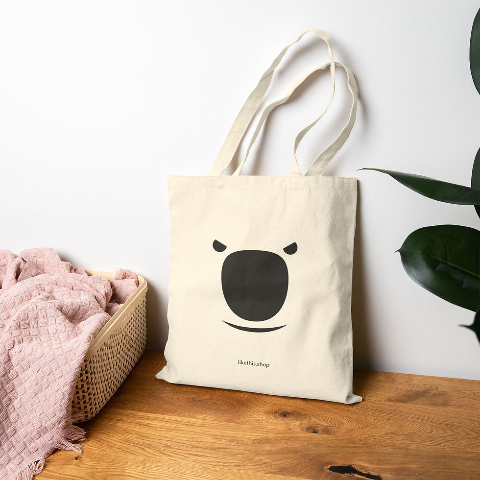 Thumbnail: A fierce polar bear face cotton canvas tote bag stands on the floor