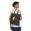 Thumbnail: a man is carrying a Black cotton canvas tote bag with big lightning Pin image