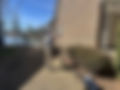 inspector taking photos of home exterior