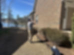 inspector taking photos of home exterior