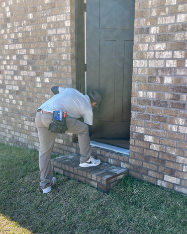 inspector checking exterior door