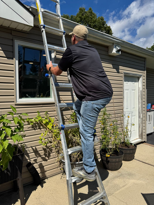 Inspector Climbing Ladder