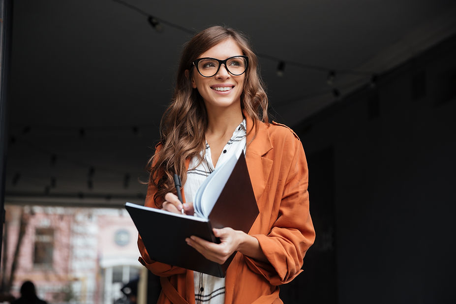 portrait-smiling-woman-making-notes.jpg