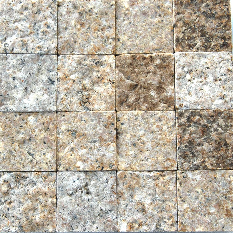Grid layout of Antique Granite tiles showcasing the natural color variations and weathered, old-world texture.