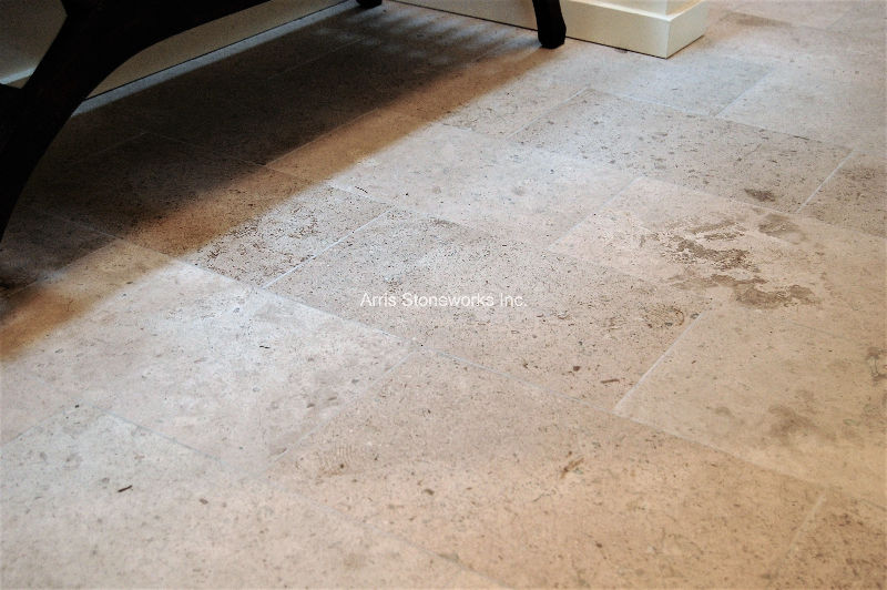 Interior flooring featuring Rattan Limestone with a honed finish by Arris Stoneworks