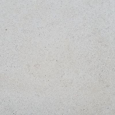 Premium honed Lueders Buff Limestone finish. Smooth, low-sheen architectural texture engineered for minimalist luxury interior walls, high-end stone flooring, and clean-lined custom fabrication.