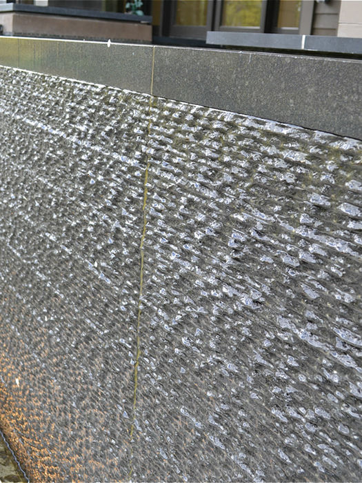 Obsidian Basalt water feature with a custom Pointstalk textured finish.