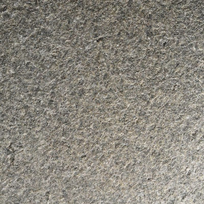 Flamed and brushed Pepper Corn Granite featuring a rugged yet refined texture that emphasizes the natural depth and durability of the dark brown stone