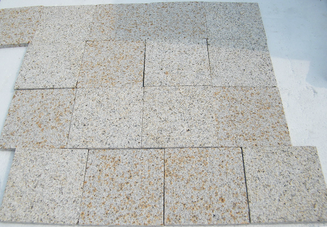 Large-format paving layout of Tuscan Granite showcasing its classic warm-toned color range.