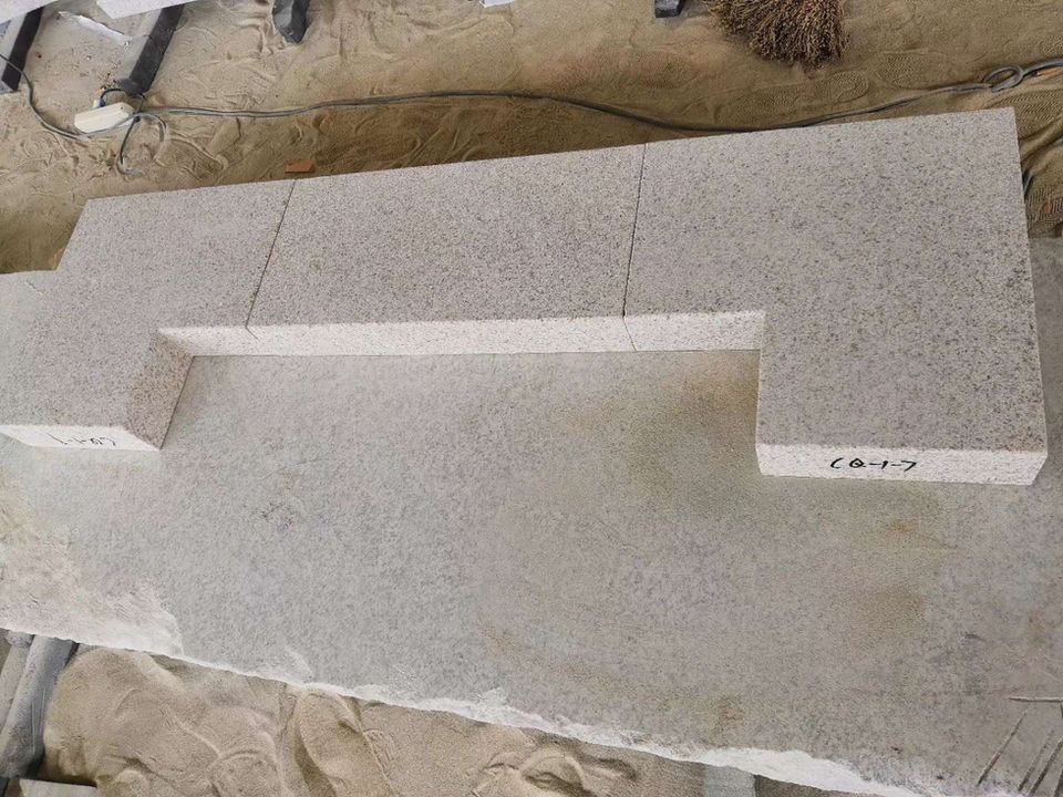 Precision-cut Tuscan Granite paver with a custom linear slot drain, demonstrating high-end architectural fabrication for seamless patio and pool deck drainage.