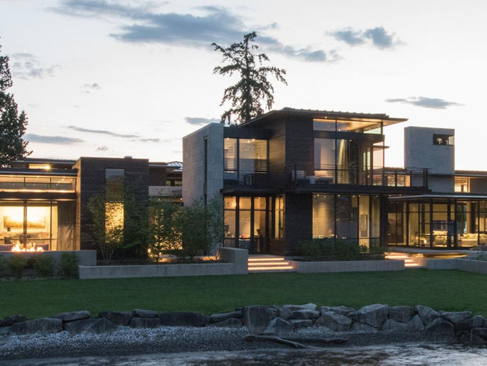 Ecru Limestone wall cladding with a custom Bladestalk finish for a modern Pacific Northwest home exterior and interior.