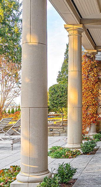 Custom-fabricated Glenn Limestone columns and classical balustrades overlooking the water for a luxury Pacific Northwest estate.