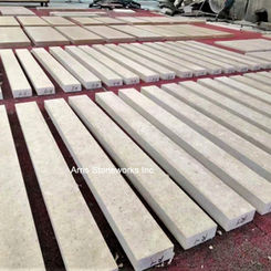Custom fabricated Coffee Limestone stair treads with a thick profile, ready for installation.